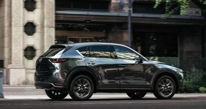 Grey 2020 Mazda CX-5 Driving on the road | Neil Huffman Mazda in Louisville, KY