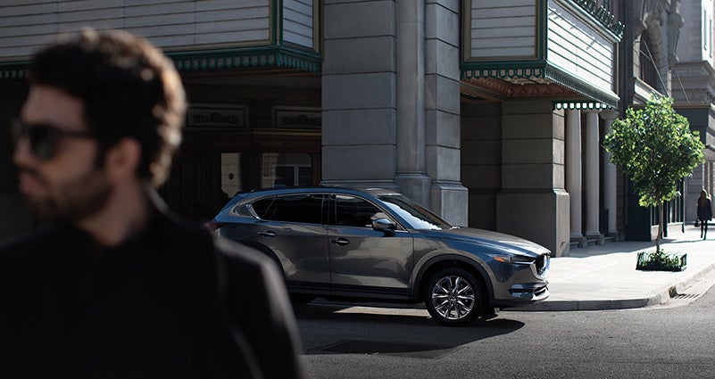 Grey 2020 Mazda CX-5 parked on the street | Neil Huffman Mazda in Louisville, KY